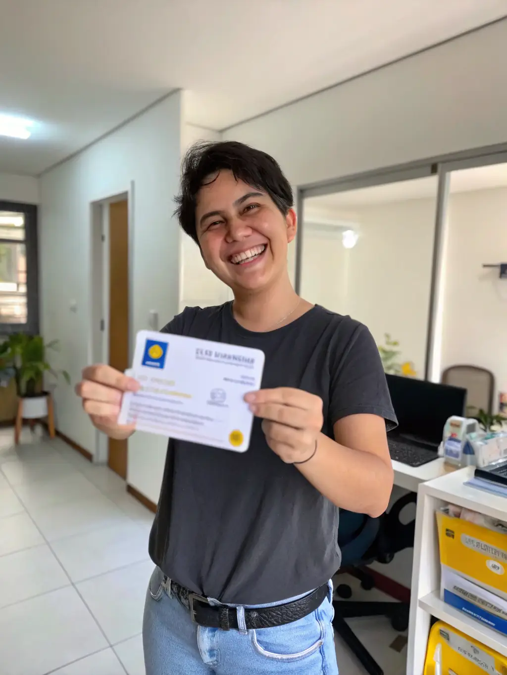 A person holding up their South African ID card next to their face, smiling confidently.
